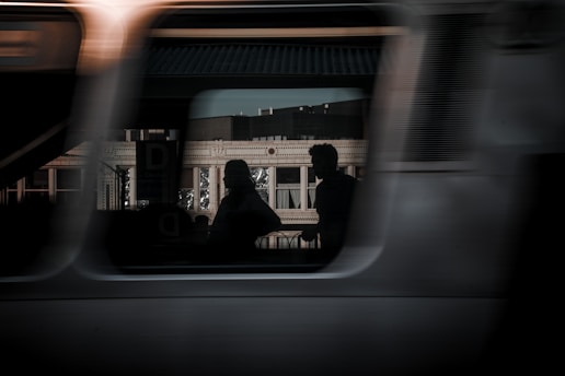 A blurry photo of a train with people on it