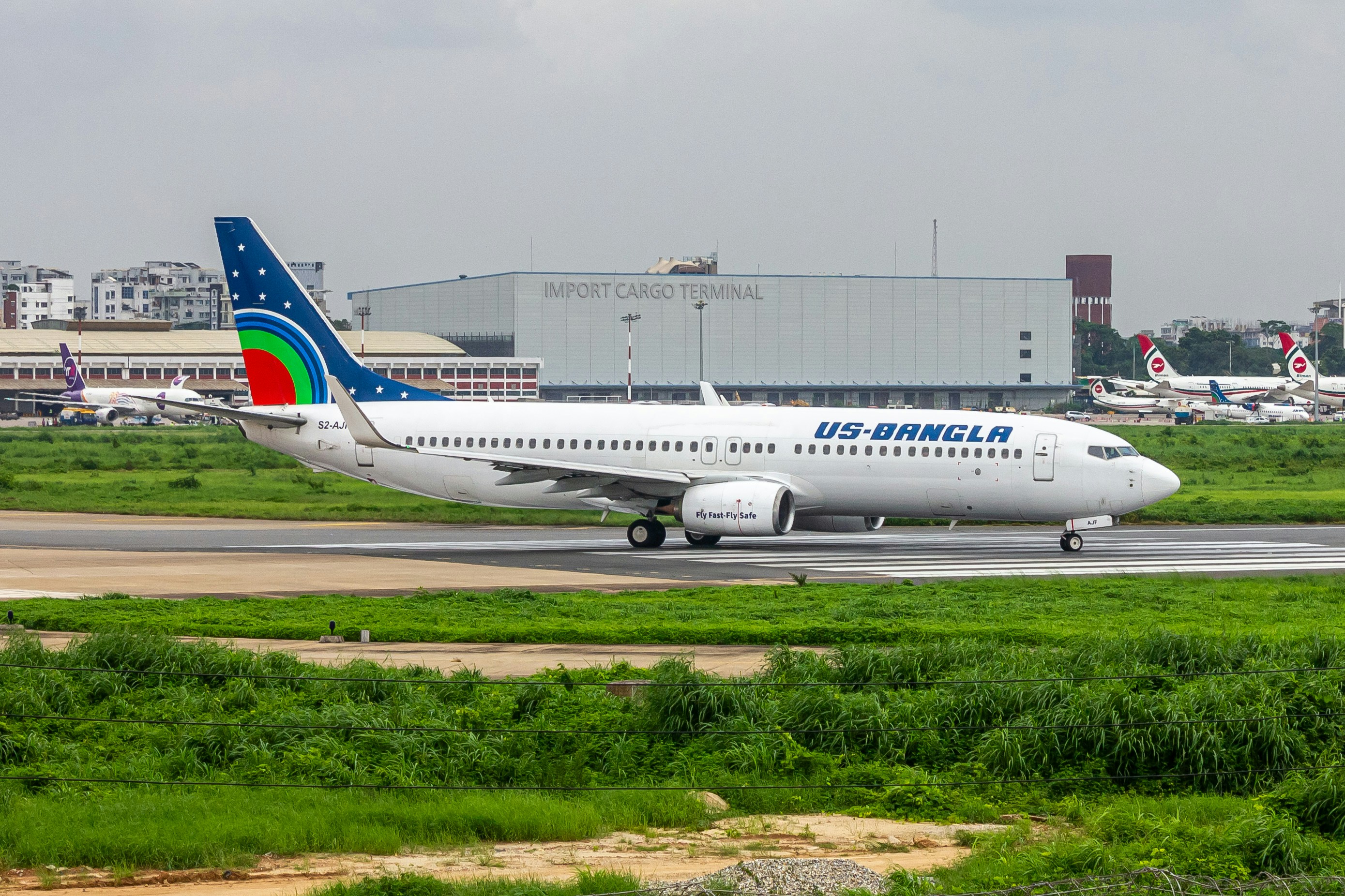 A large jetliner sitting on top of an airport runway, Alpha Juliet Foxtrot lining up on VGHS runway 14 💯