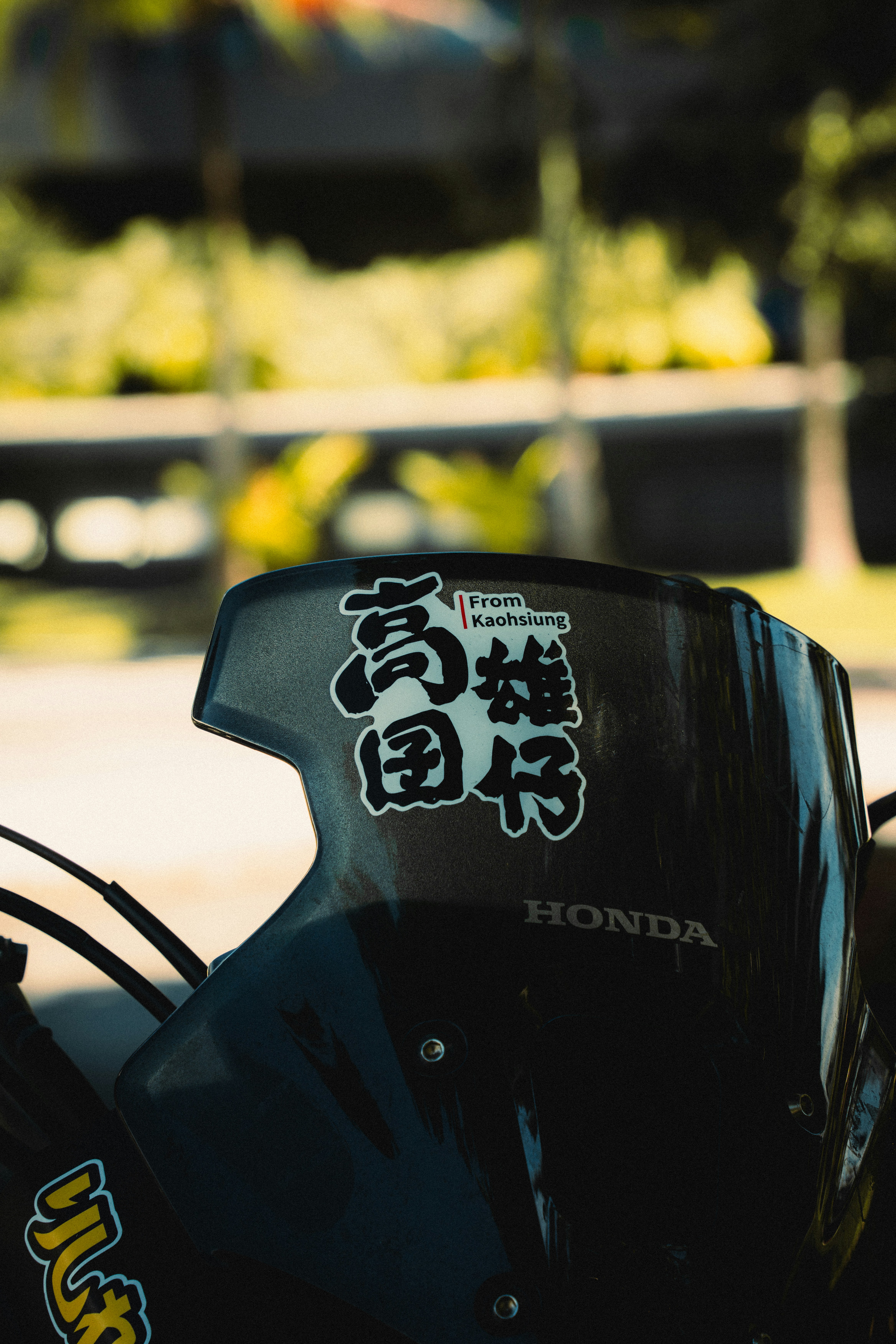 A close up of a motorcycle with asian writing on it