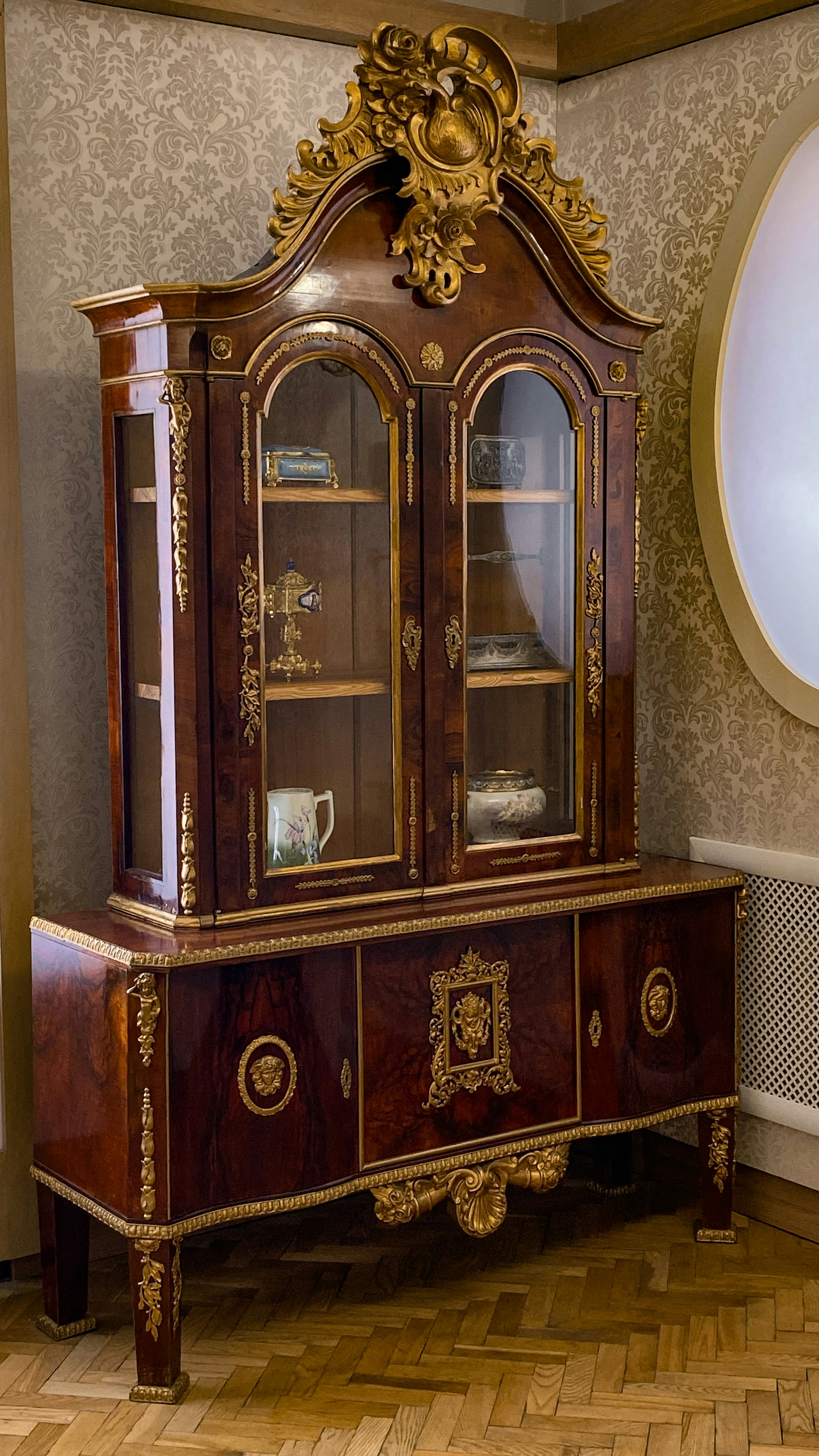 Edwardian mahogany display cabinet with glass doors, rich dark wood, polished showroom