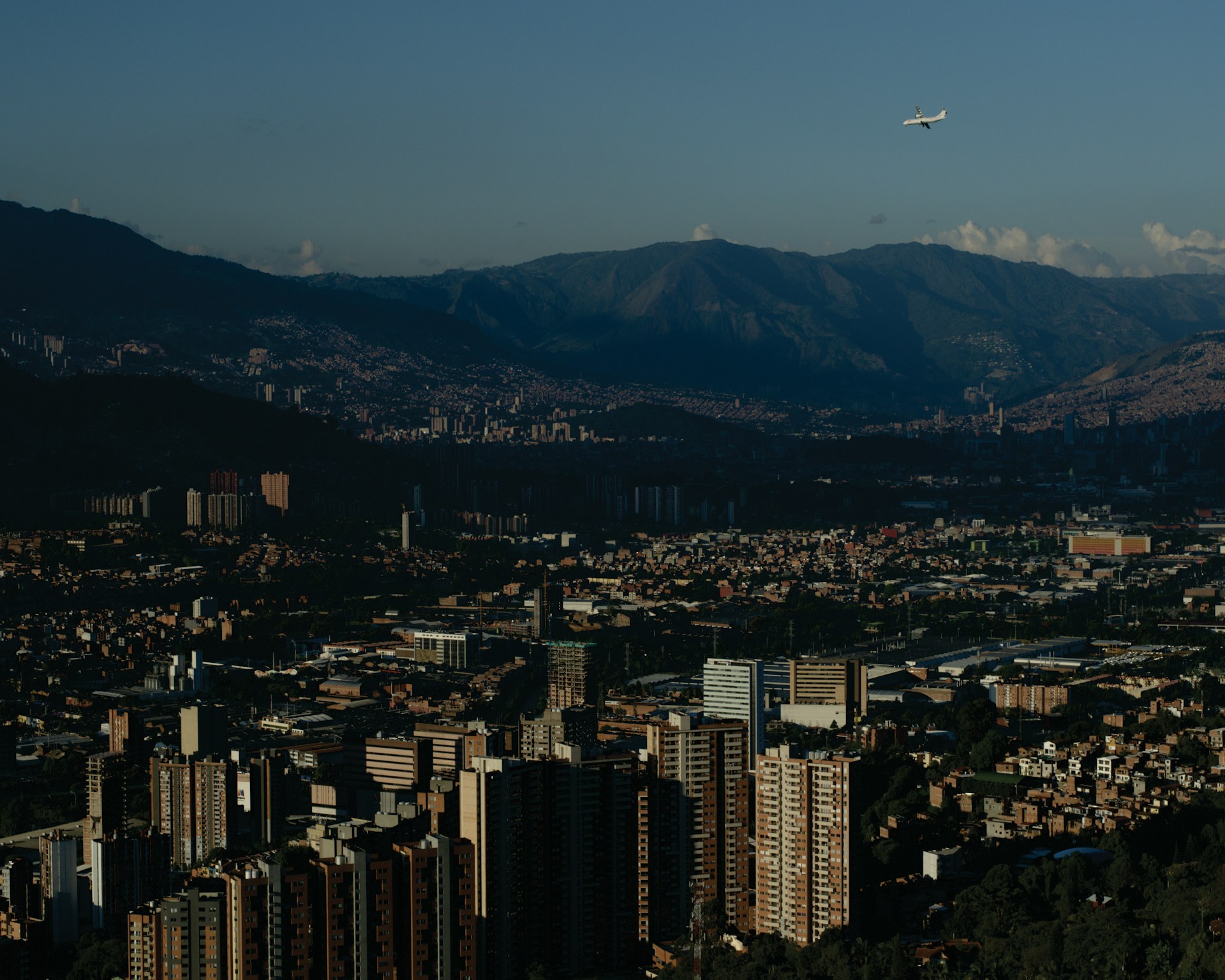 A view of a city with mountains in the background