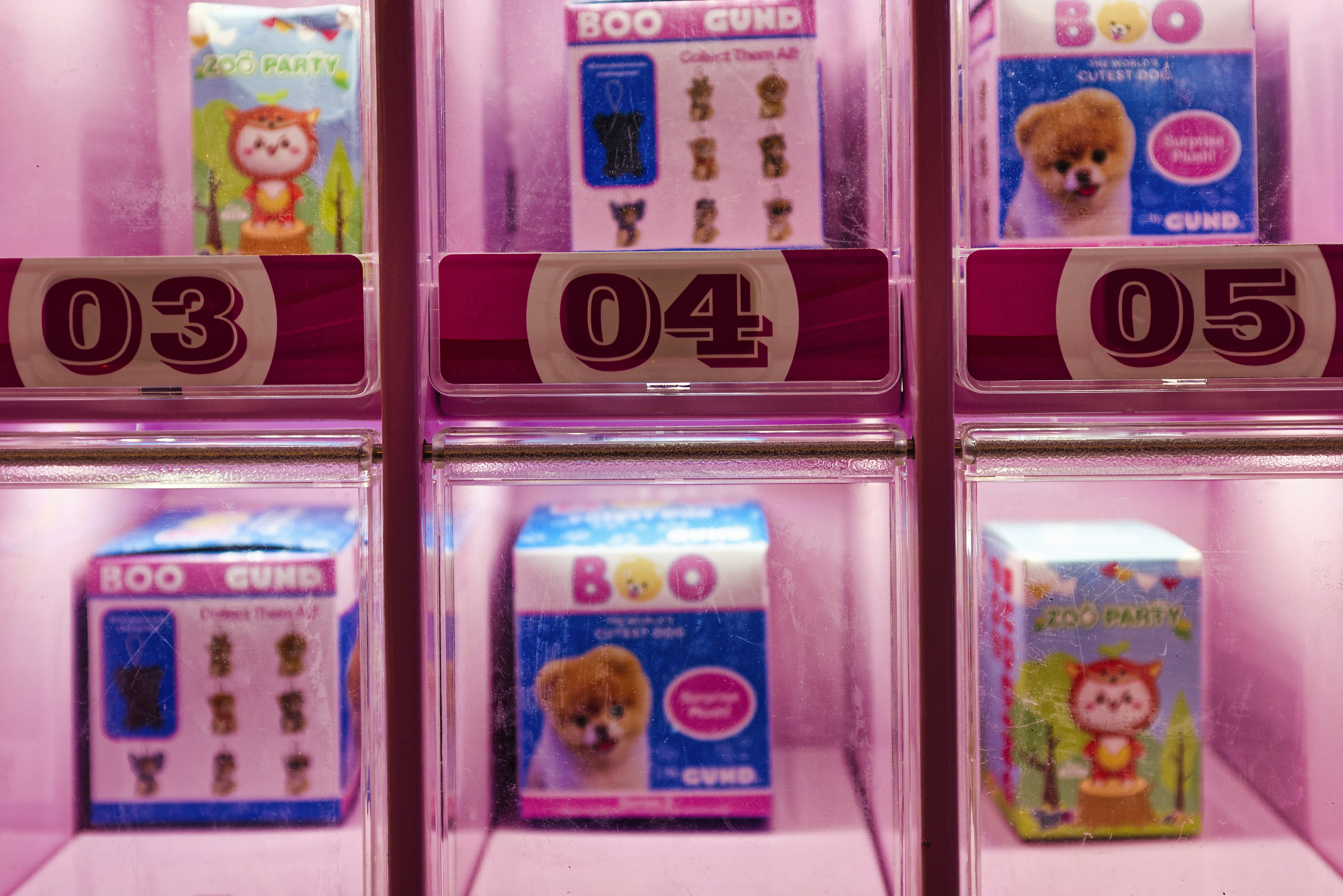 A display case filled with different types of toys