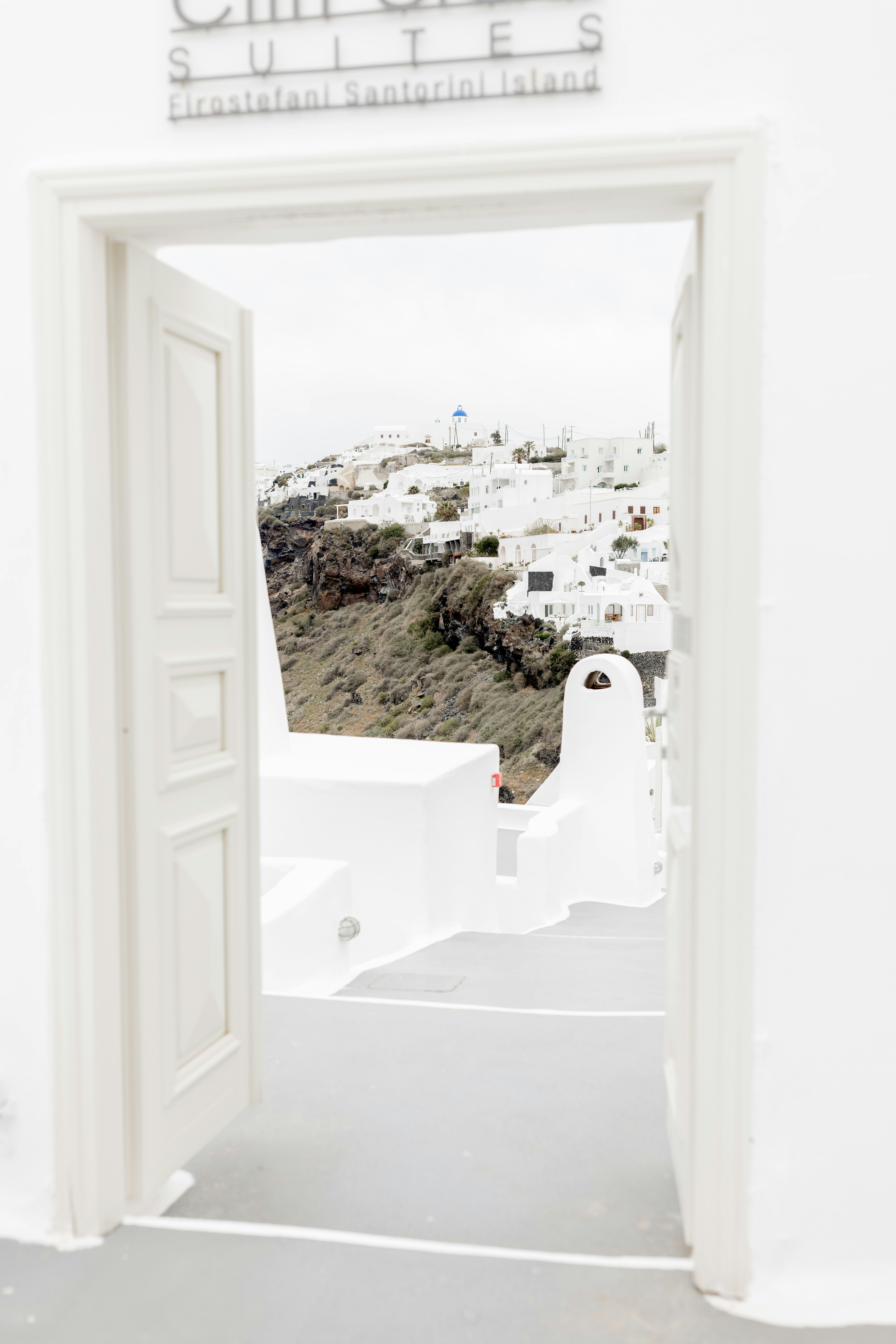 An open door leading to a white building
