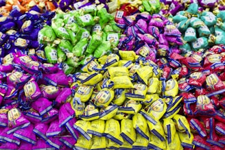 A large pile of colorful candies sitting on top of a table