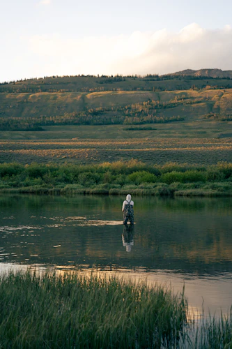 Angler fishing a wide South Platte canyon run at Trumbull, Colorado
