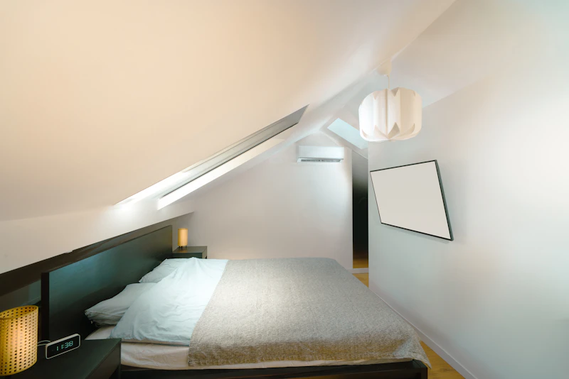 Loft bedroom with a sloped ceiling