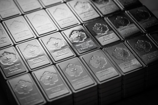 A pile of silver bars sitting on top of a table