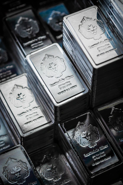 A pile of silver bars sitting on top of each other