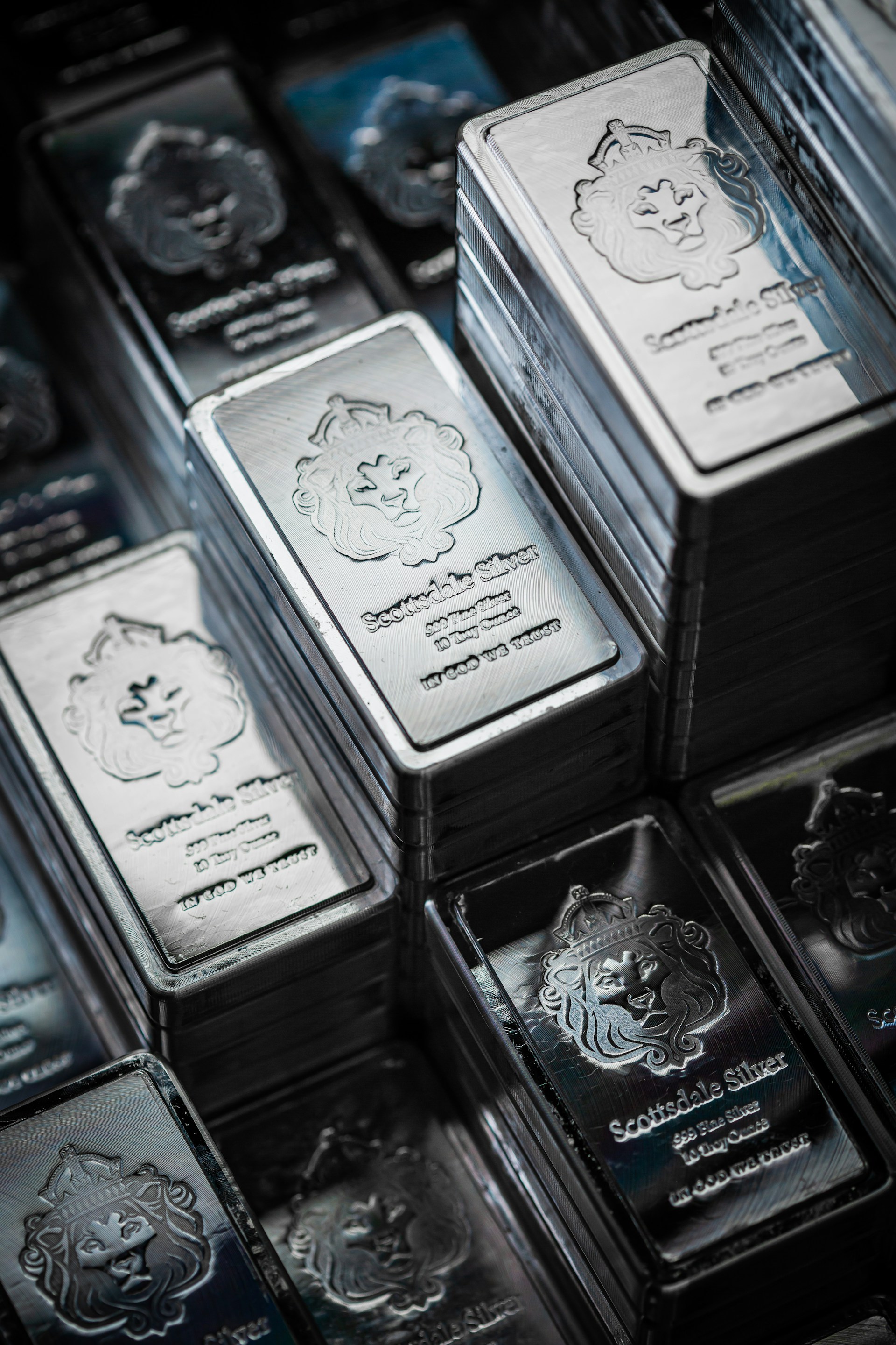 A pile of silver bars sitting on top of each other