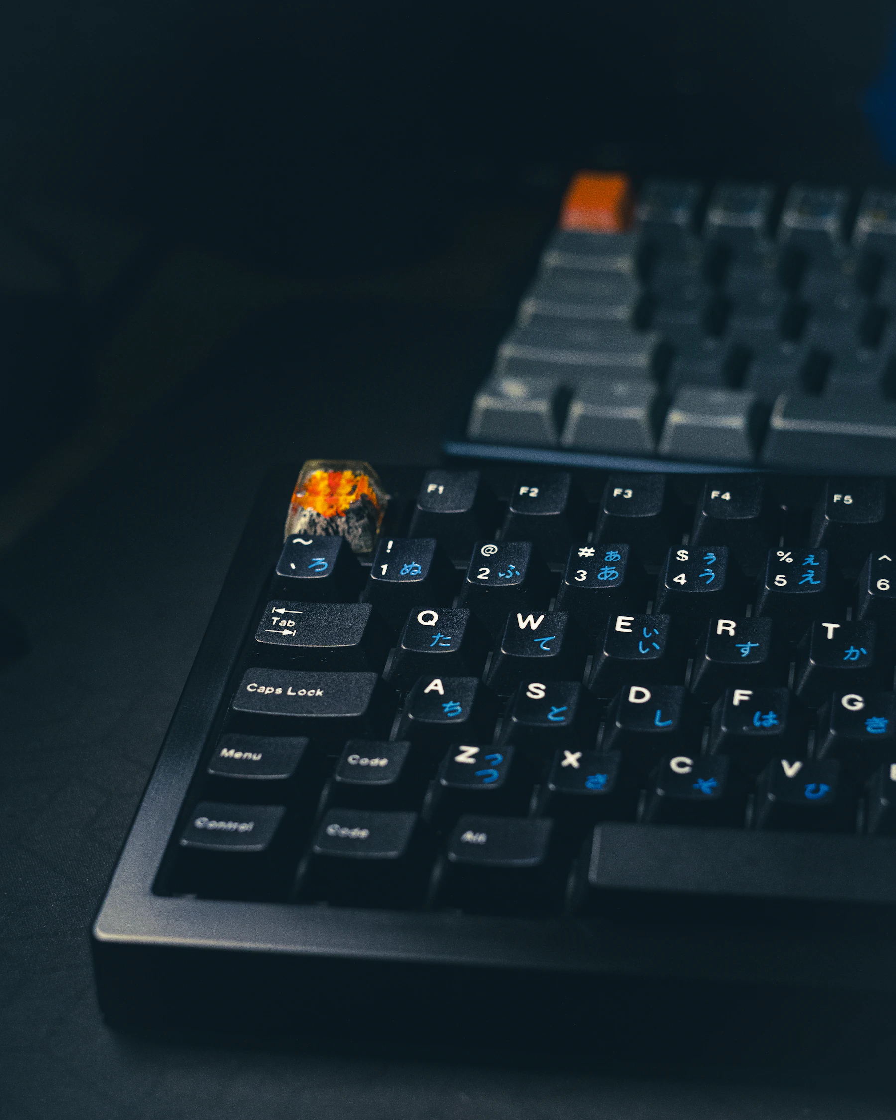 Close-up of mechanical keyboards in a dark gaming environment