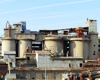 A large industrial building with lots of rust on it