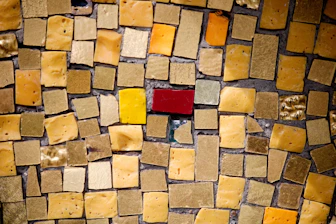 A close up of a mosaic tile wall