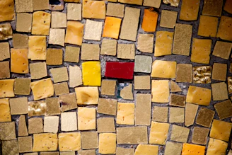 A close up of a mosaic tile wall