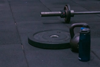 A gym equipment laying on the ground on a sidewalk