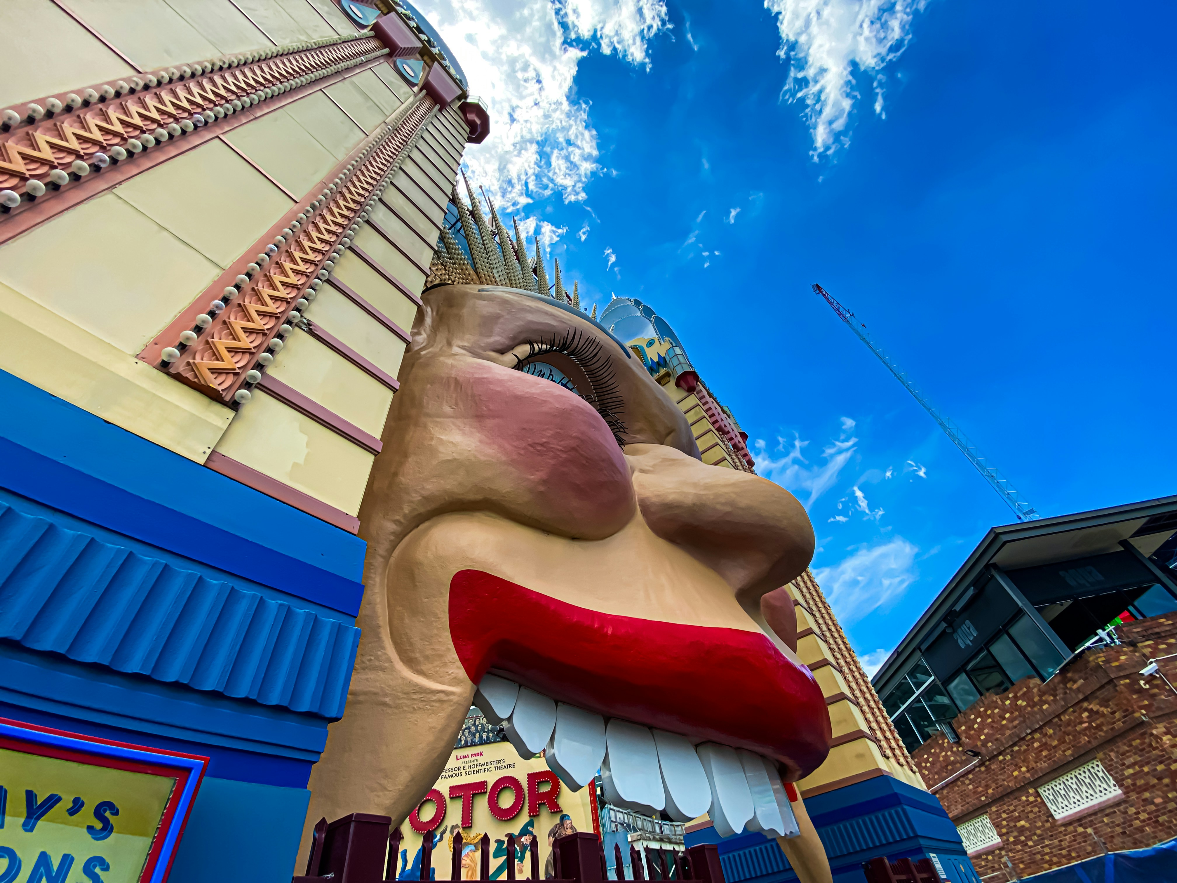 A large statue of a dog on the side of a building