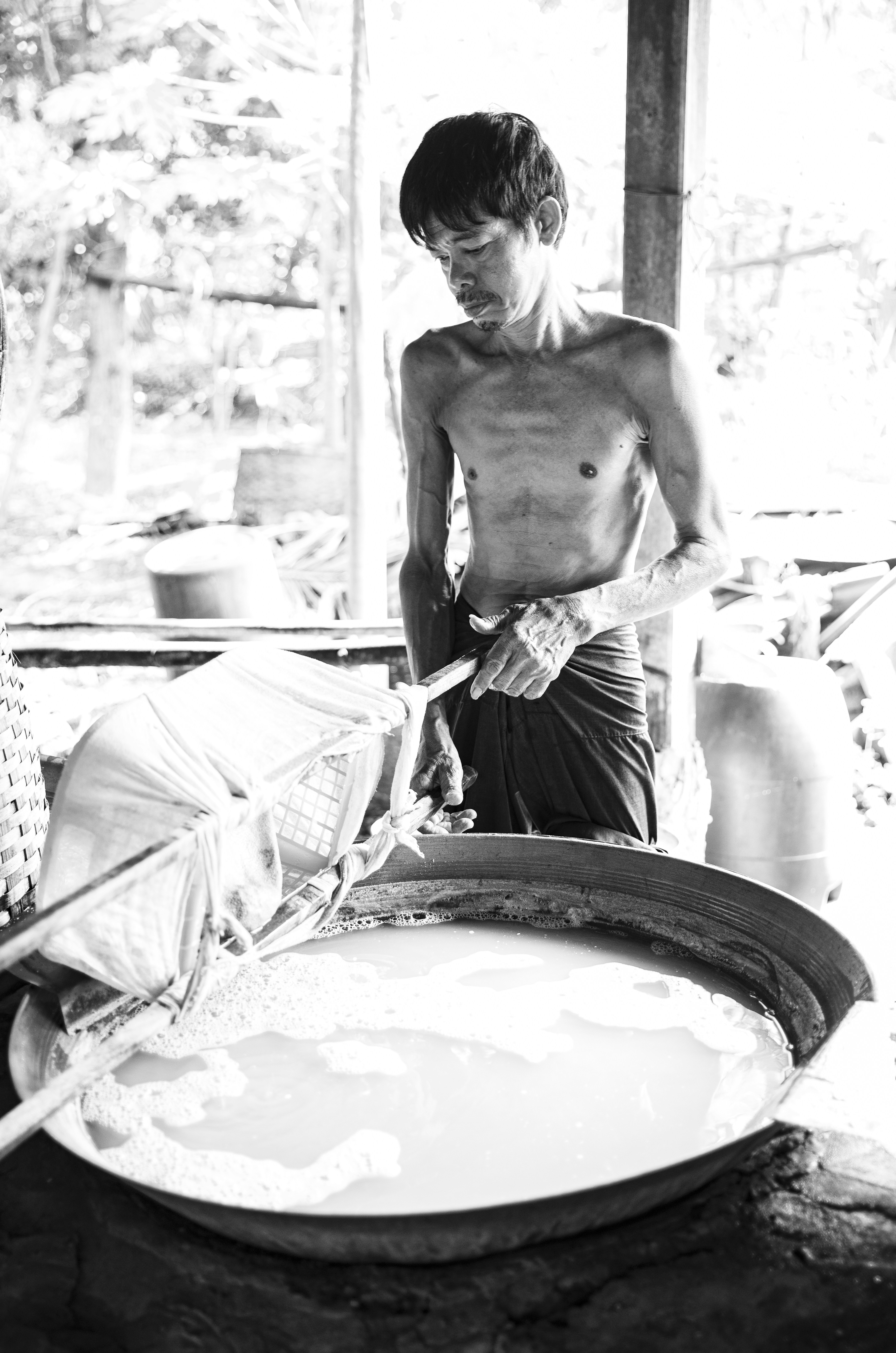 A man standing next to a woman in a kitchen