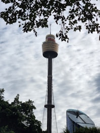 A tall tower with a sky background