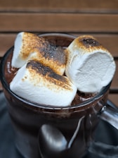 A cup of hot chocolate with marshmallows in it