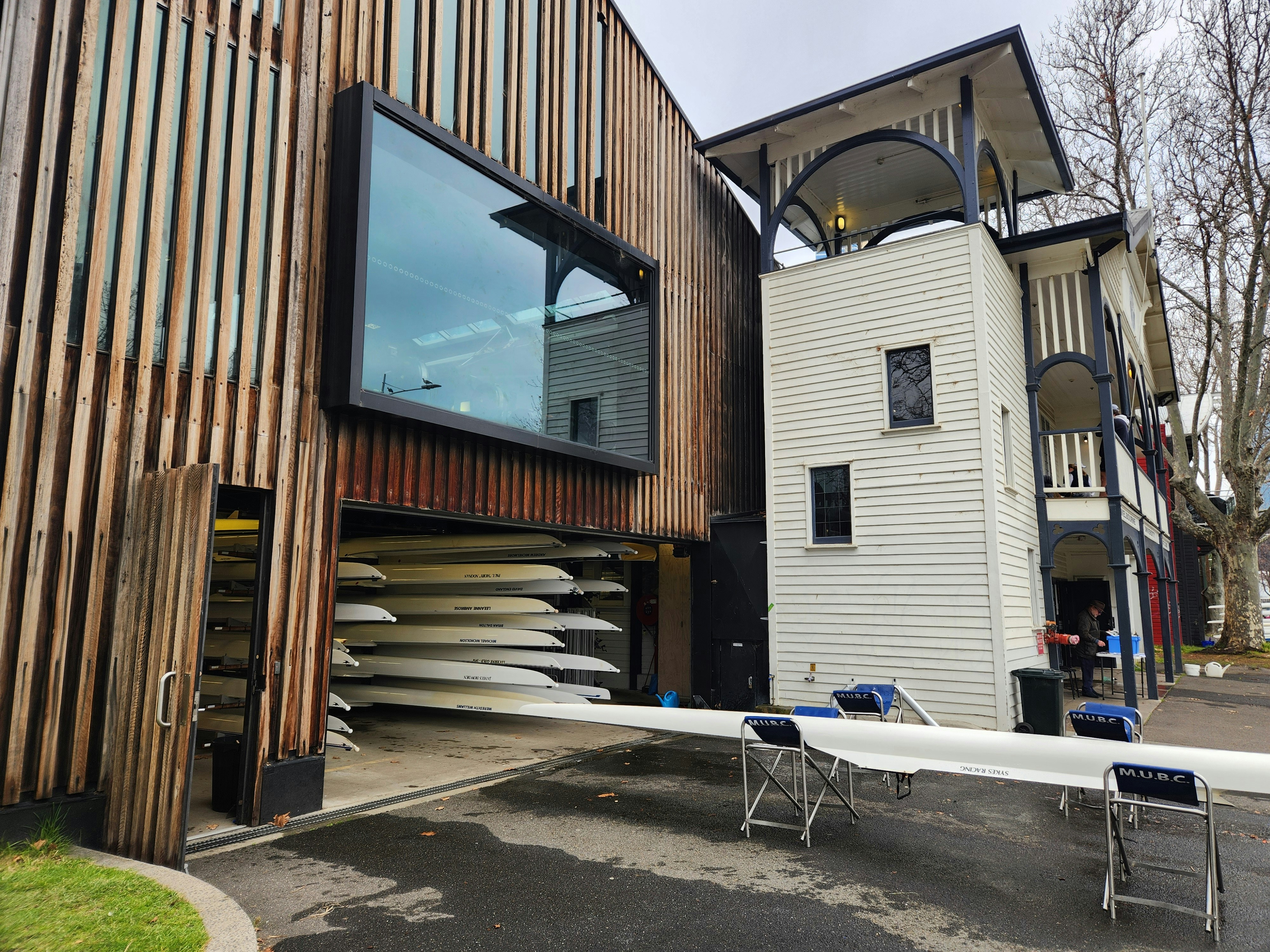 A building that has a bunch of surfboards in front of it
