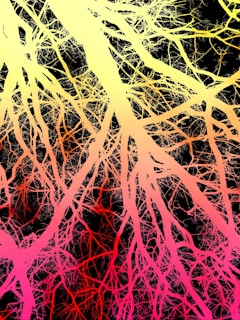 A painting of a tree with pink and yellow branches