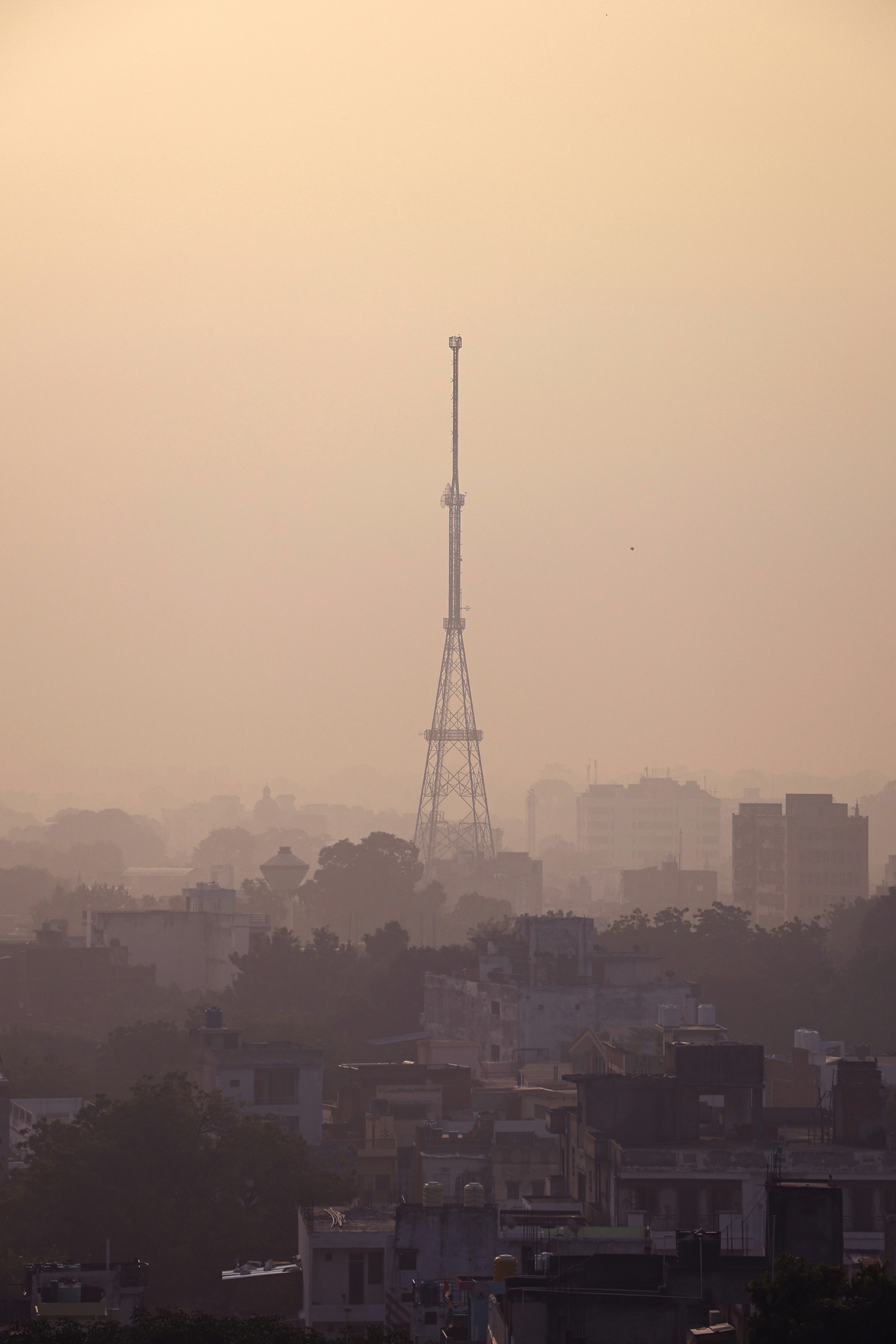 A view of a city with a tower in the distance