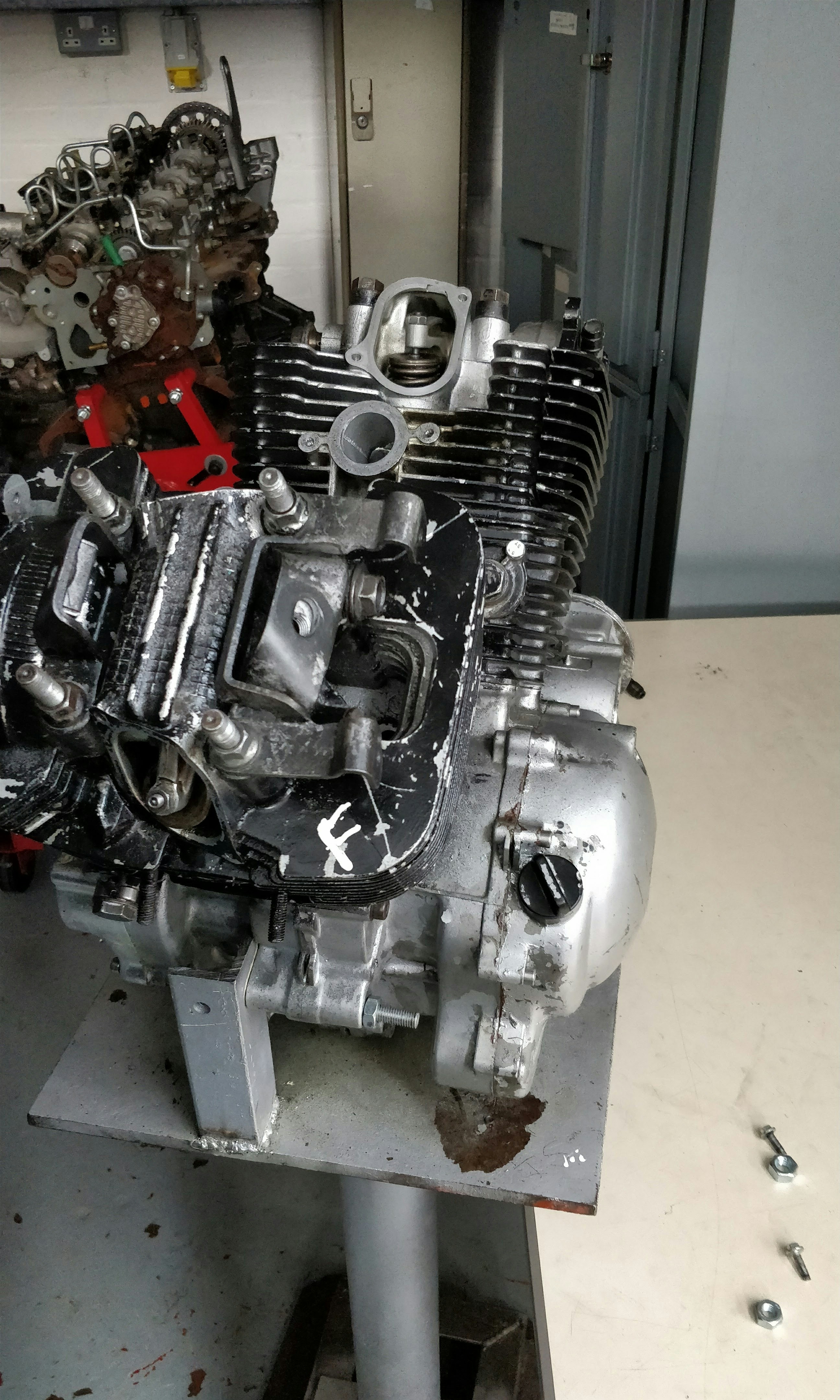 The engine of a car is sitting on a table