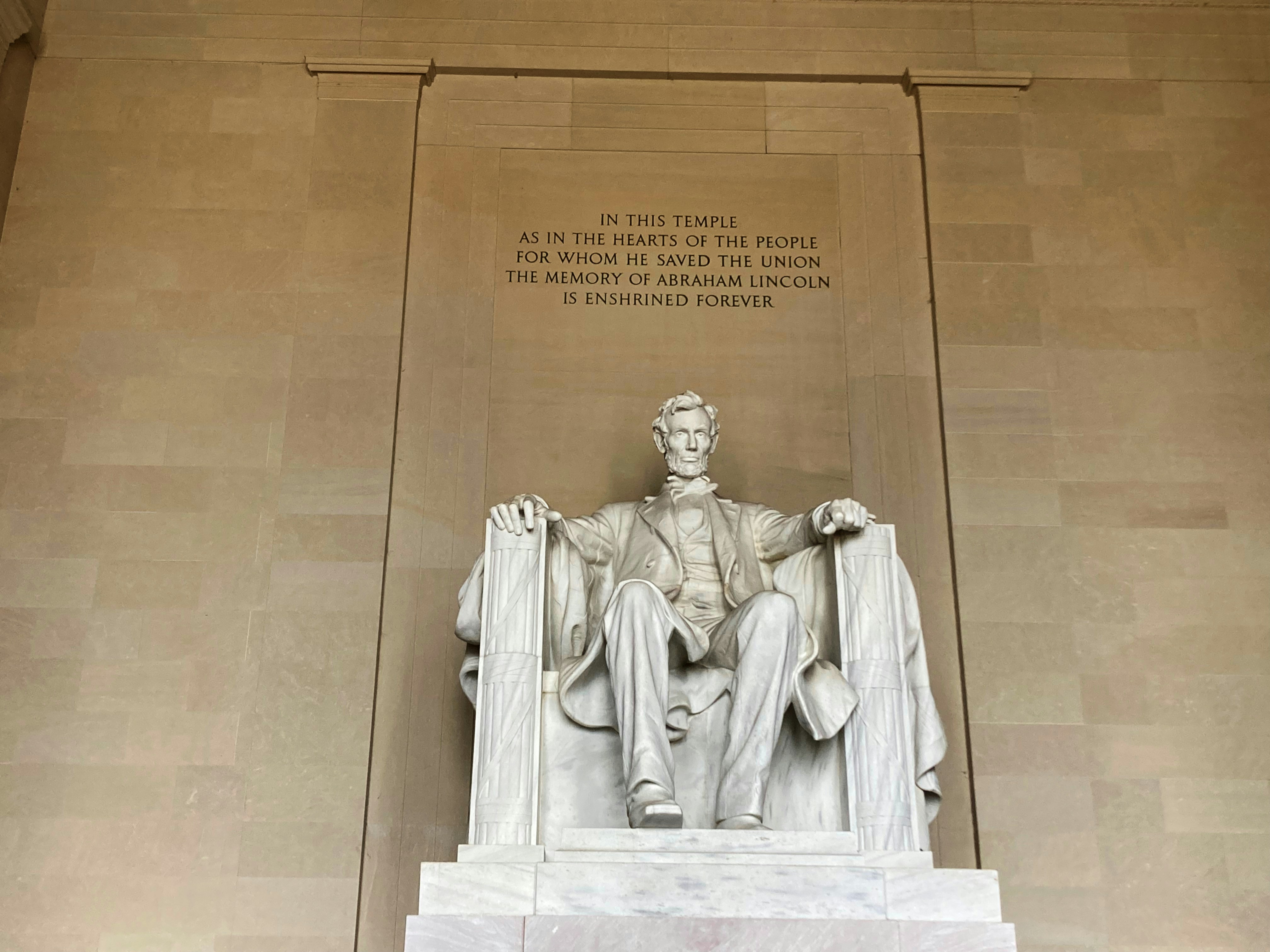 A statue of abraham lincoln in the lincoln memorial