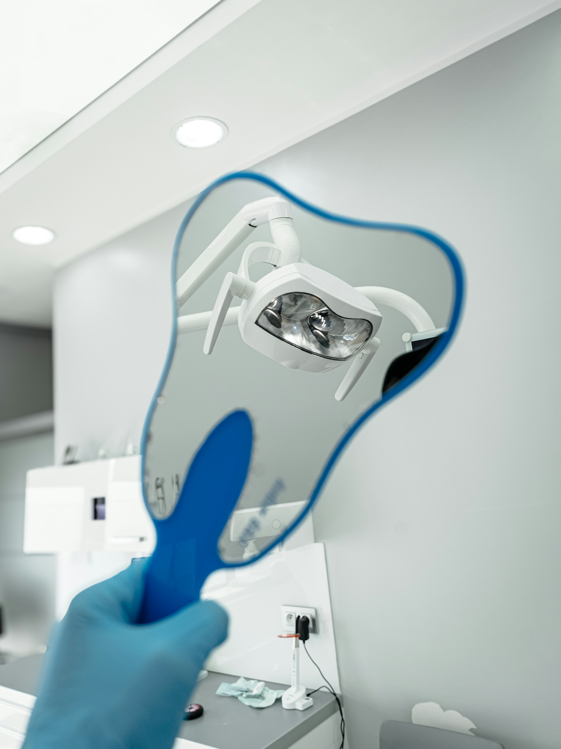 A person holding a toothbrush up to the camera