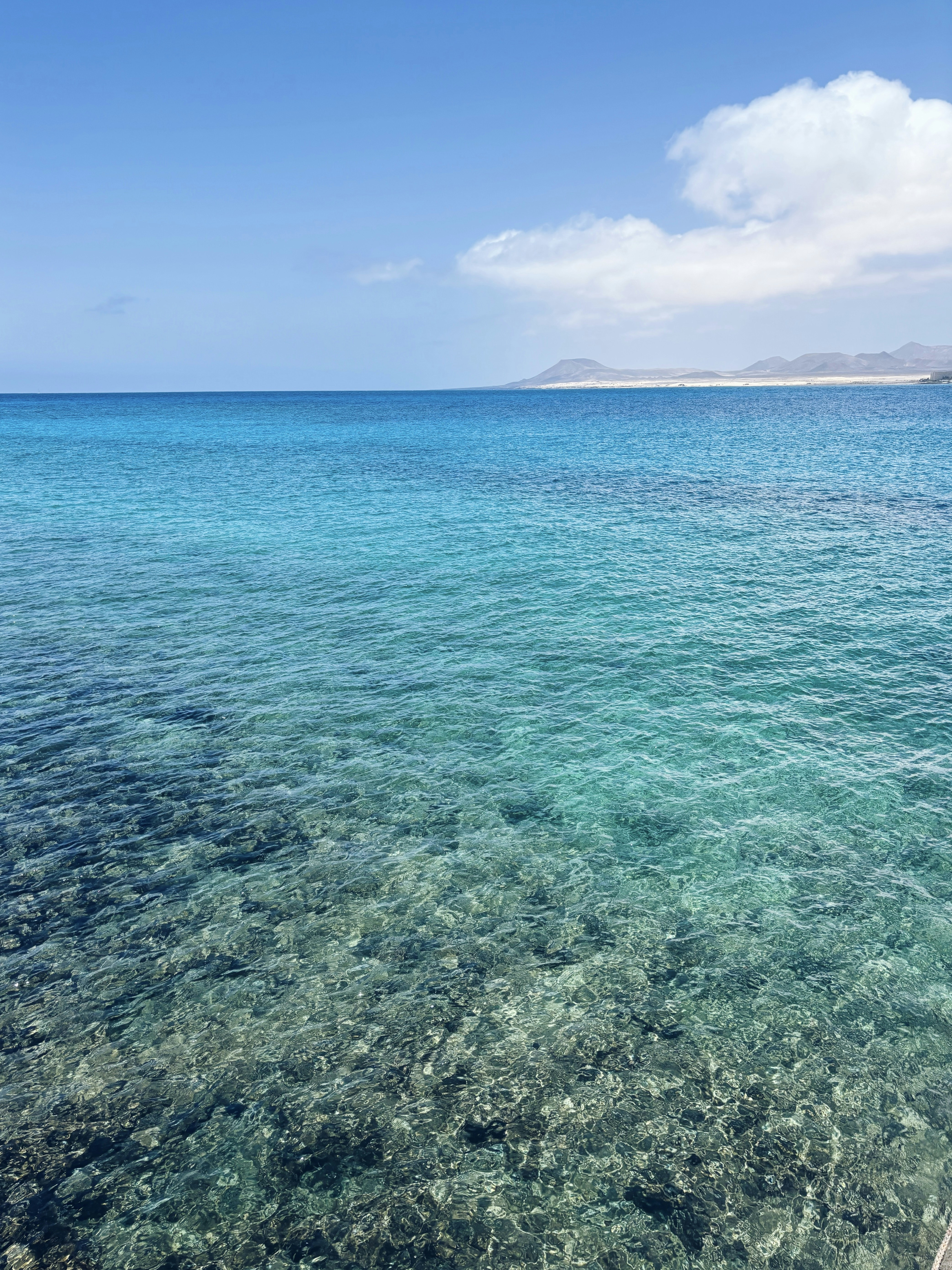 A boat floating on top of a body of water