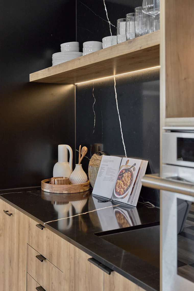 Modern kitchen counter with a built-in microwave above the countertop