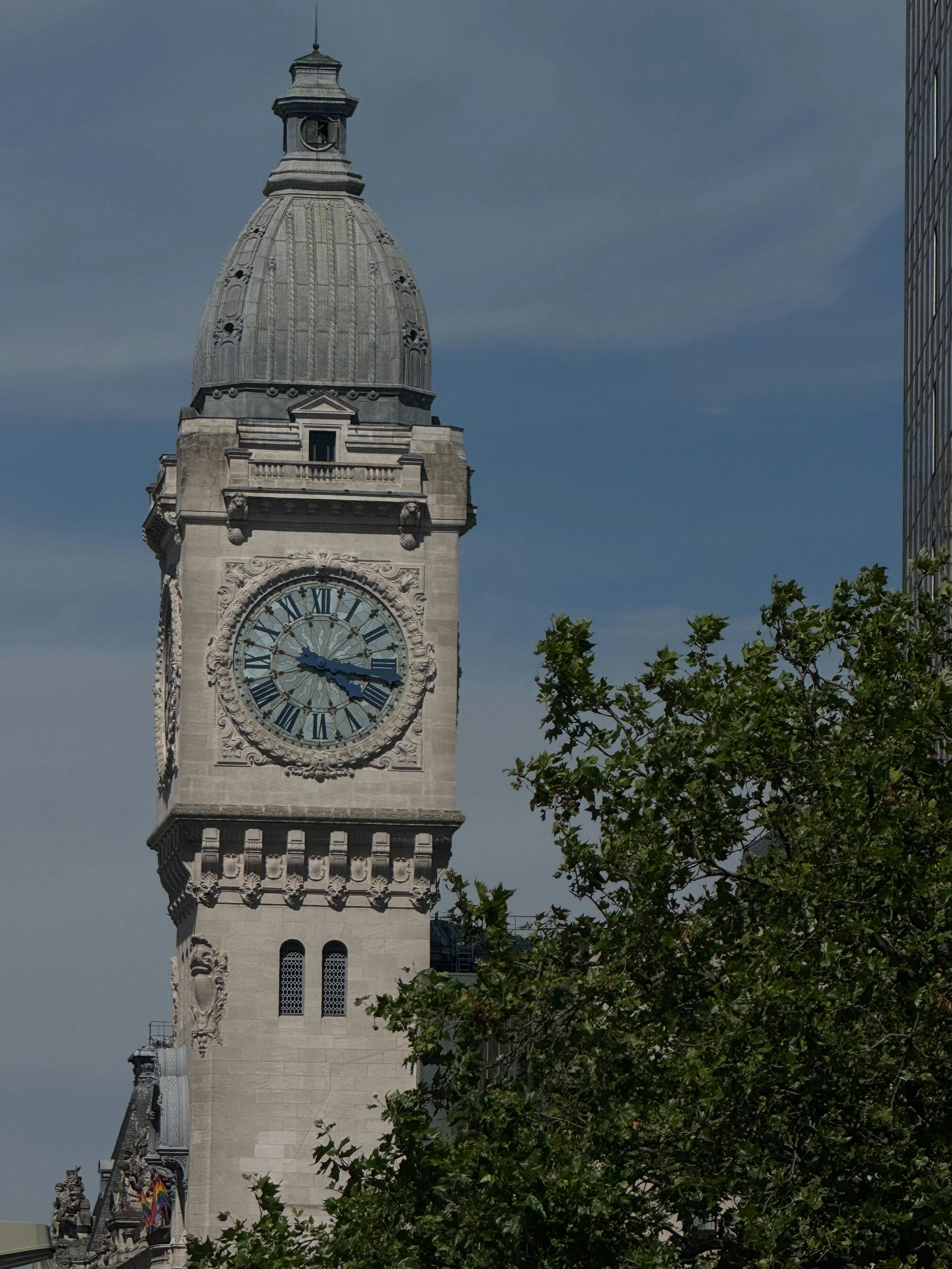 A tall clock tower with a sky background