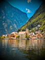 A scenic view of a village on a lake