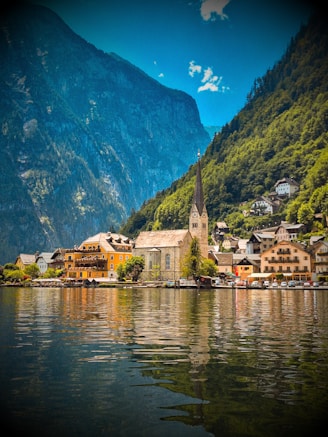 A scenic view of a village on a lake