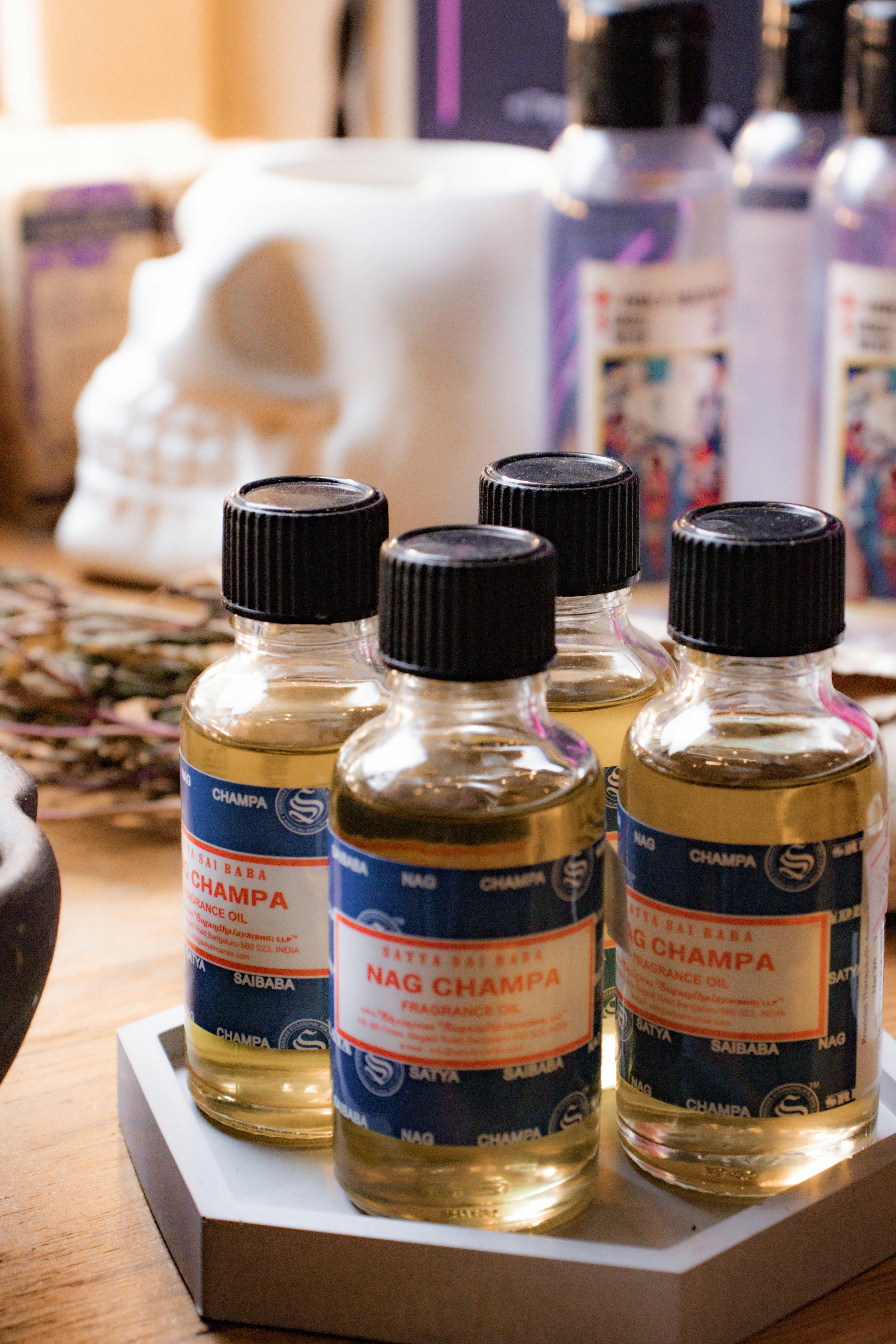Four bottles of liquid sitting on a table