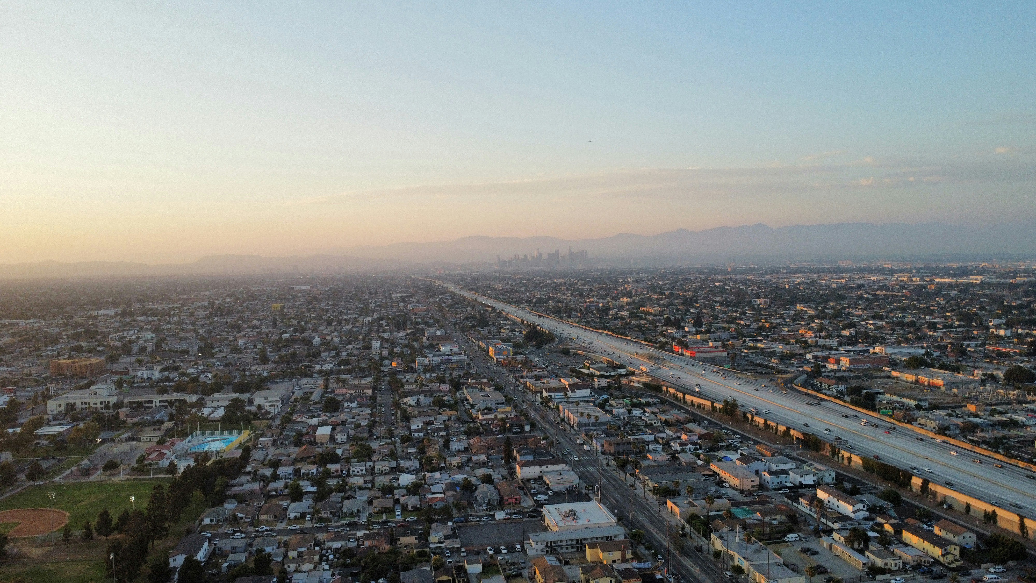 An aerial view of a city at sunset