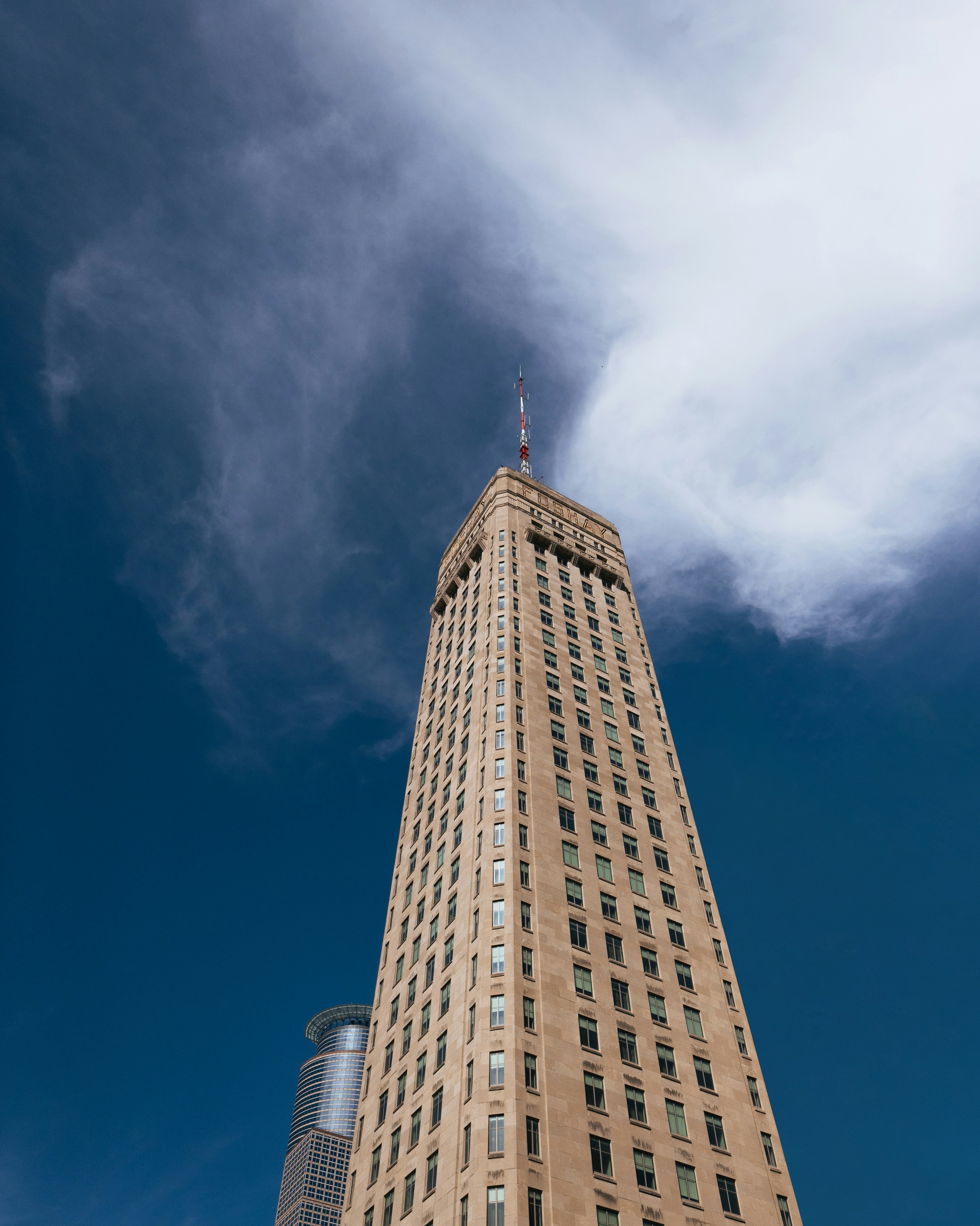A very tall building with a sky background