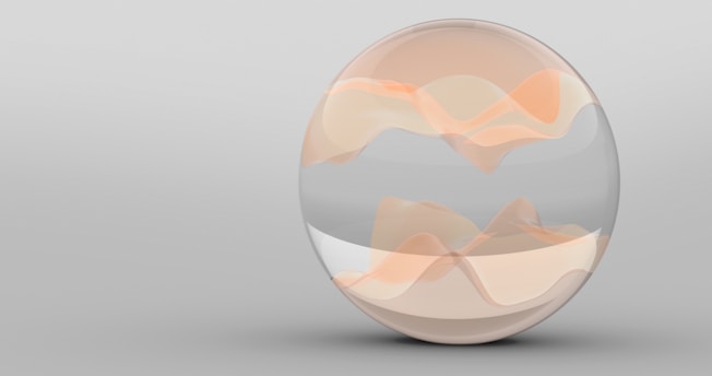 A glass egg with a mountain in the background