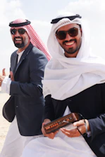 A couple of men standing next to each other