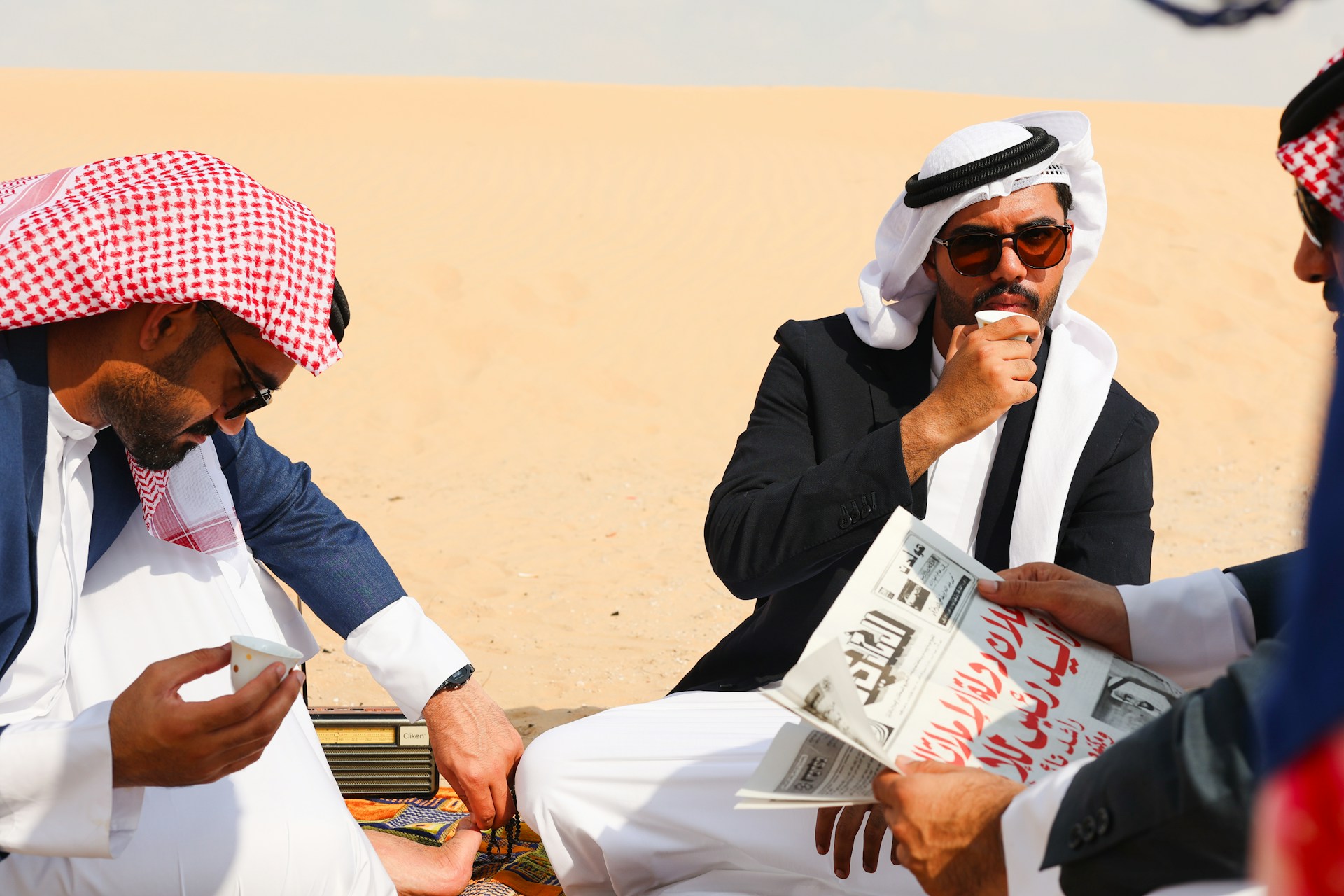 A group of men sitting next to each other