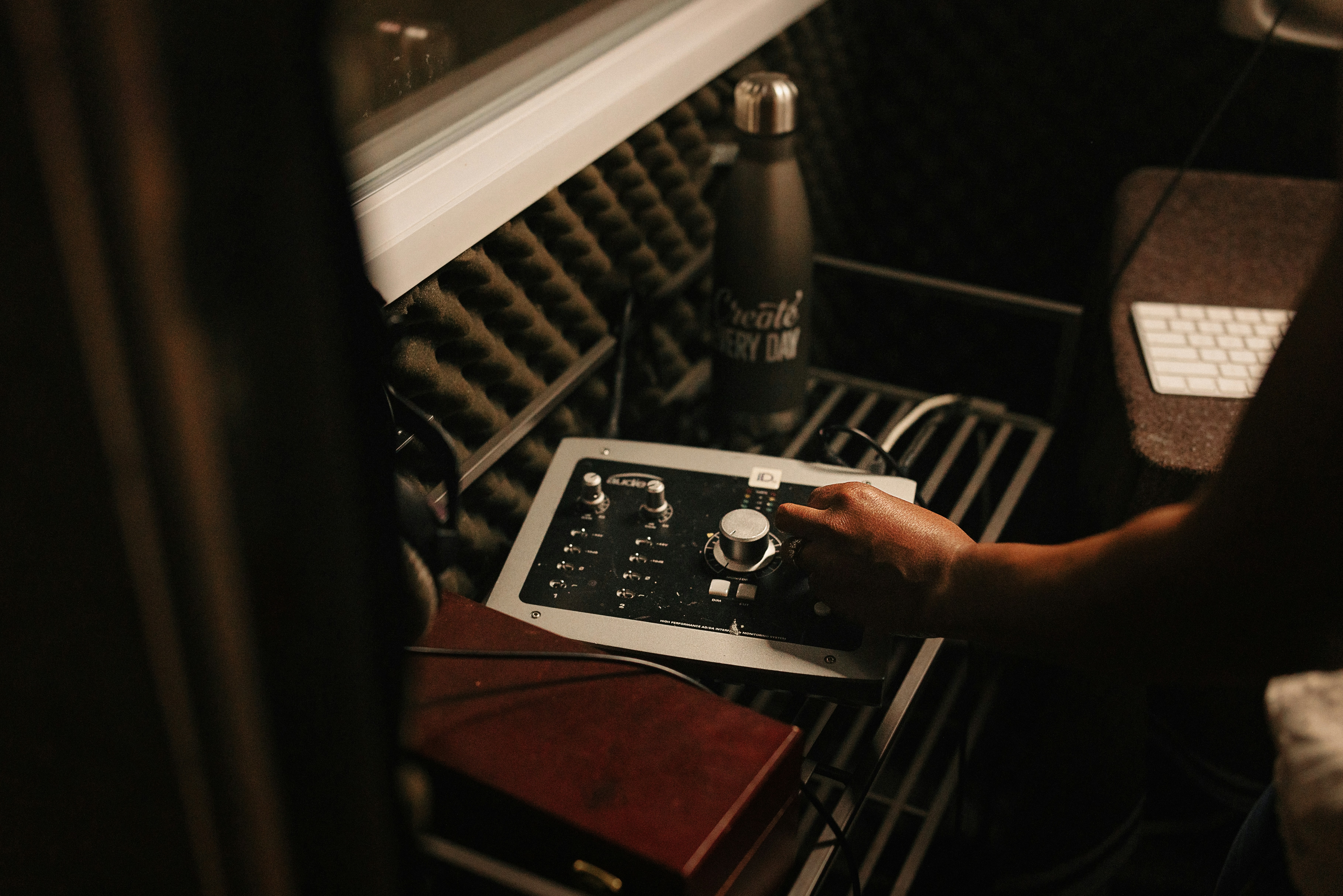 A person working on a tablet in a wine cellar