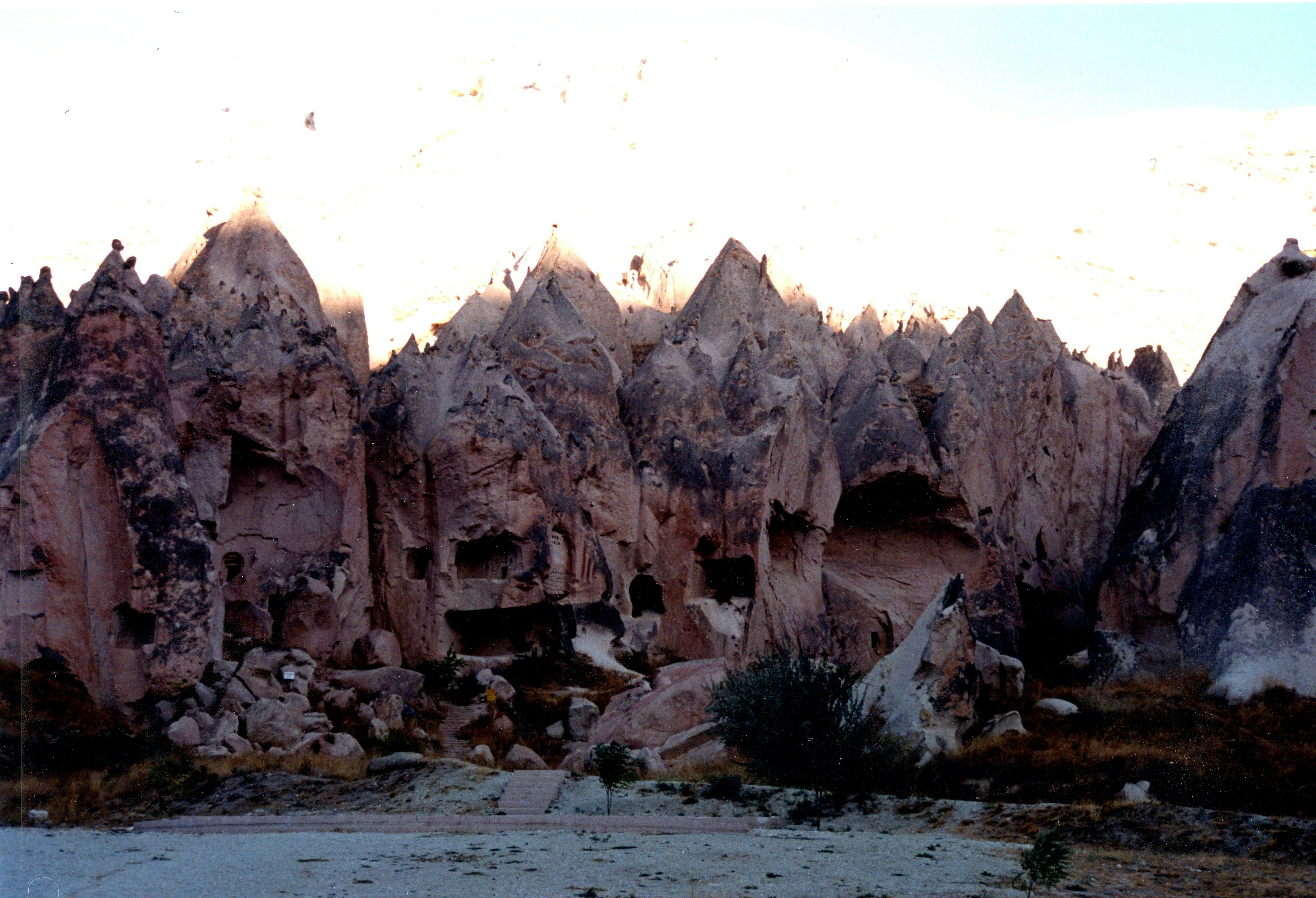 A large rock formation with a sky background, 
