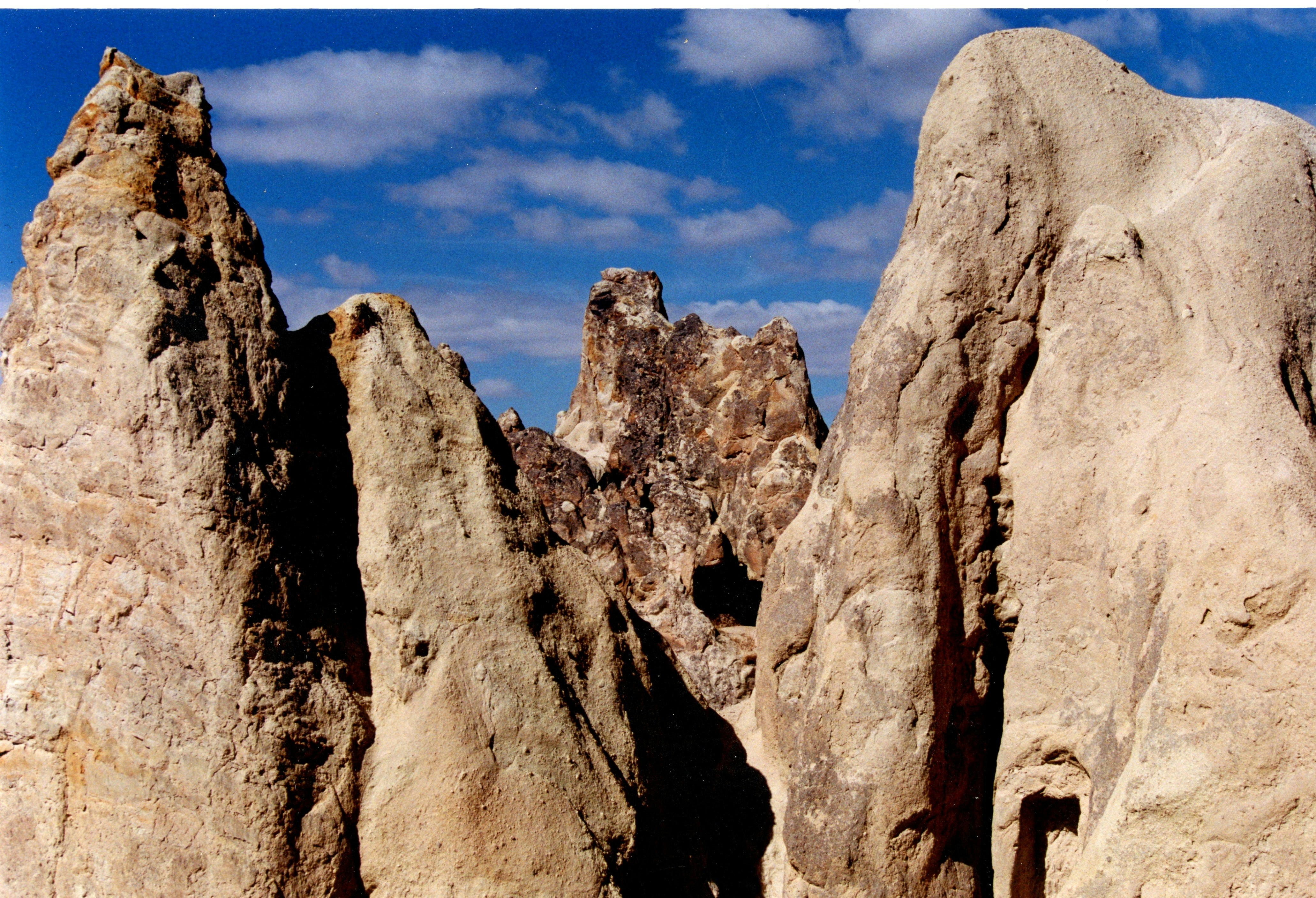 A group of large rocks sitting next to each other, 