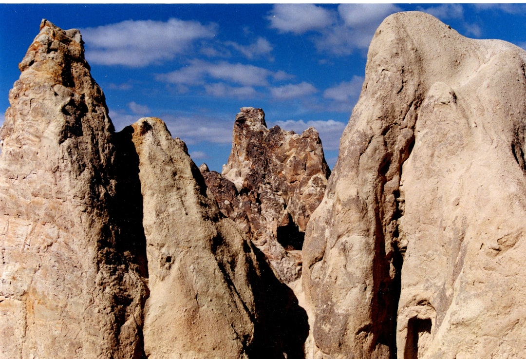 A group of large rocks sitting next to each other,