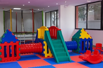 A children's play area with a slide and slides