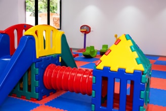 A brightly colored play area with a slide