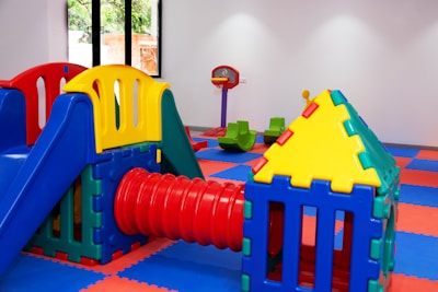 A brightly colored play area with a slide