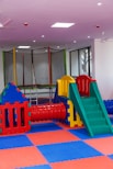 A children's play area with a slide and climbing equipment