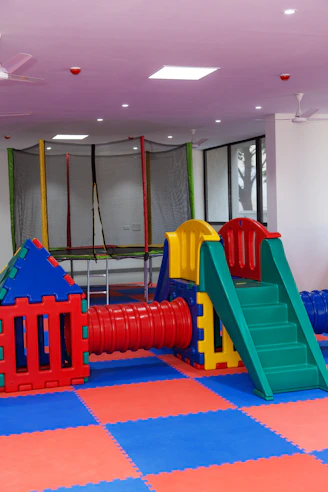 A children's play area with a slide and climbing equipment