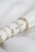 A close up of a napkin with rings on it