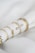 A close up of a napkin with rings on it